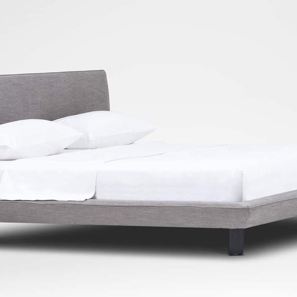 Modern platform bed with slim frame and padded headboard by Camerich.