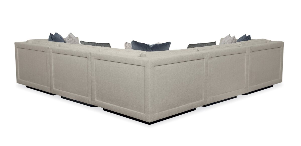 Caracole Fusion Corner Unit with neutral oatmeal upholstery, gunmetal grey velvet accents, herringbone pillows, and a recessed wood plinth base in Simply Black.