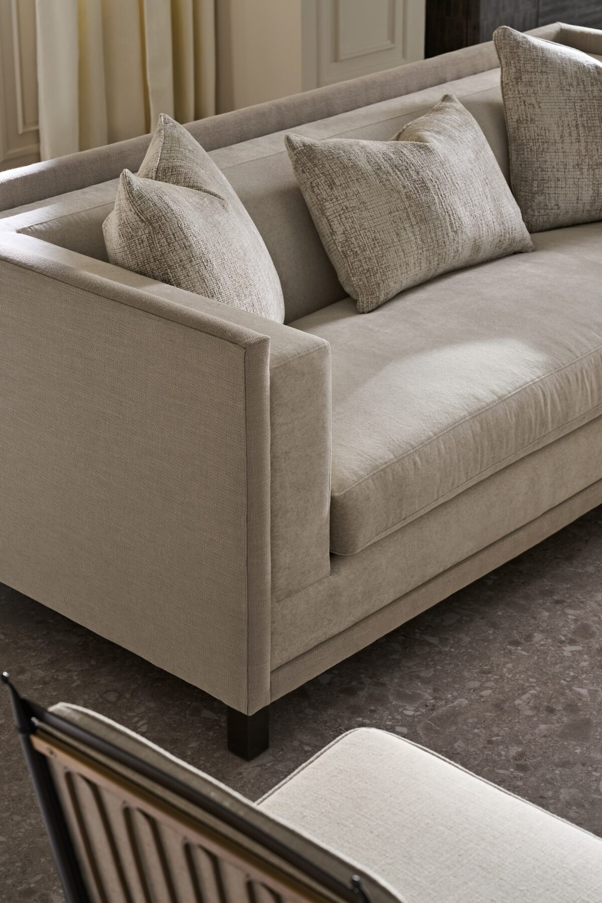 "Classic and refined Tuxedo Sofa by Caracole, featuring a sleek, structured design with plush cushions for a sophisticated and comfortable addition to any living room."