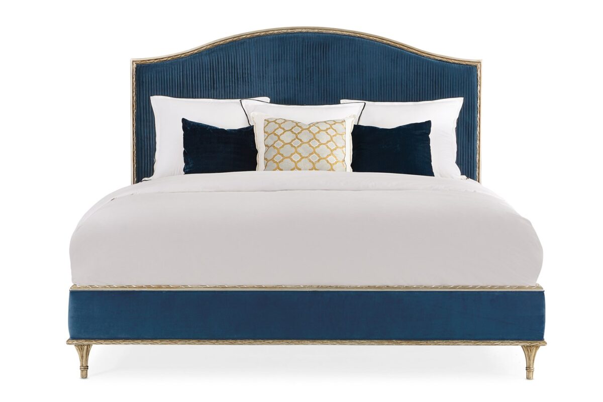 Caracole Fontainebleau Platform King Bed featuring a fully upholstered frame with exposed wood trim finished in Oracle Silver Leaf, complemented by an adjustable height bedding support.