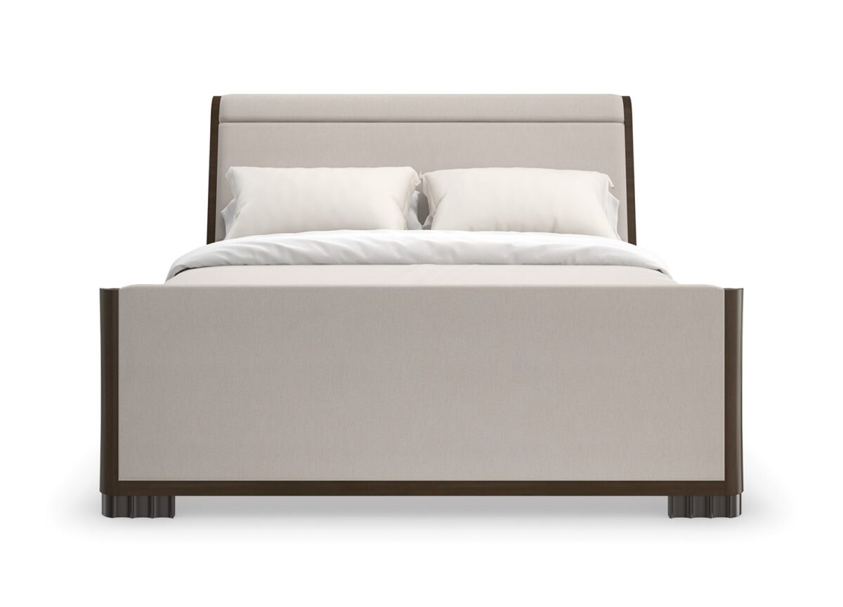 Caracole Slow Wave King Bed featuring a canted upholstered headboard and clean-lined footboard in faux slub silk, complemented by an Otter-finished footboard and side rails, and fluted Dark Chocolate legs.