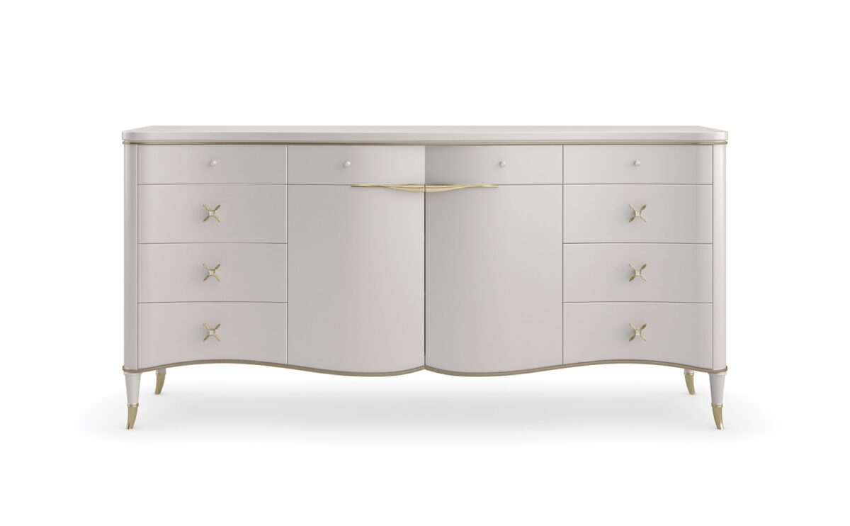 Caracole BELLE OF THE BALL dining table, featuring a spectacular, sculpted base of intertwined forms, often in a metallic or high-gloss finish.