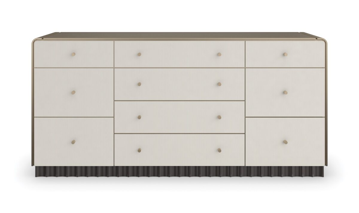 Caracole Circadian Dresser – Neoclassical-inspired 10-drawer dresser featuring micro-fluted ivory drawer fronts, a waterfall top in Whisper of Gold paint, and a contrasting Dark Chocolate scalloped base.