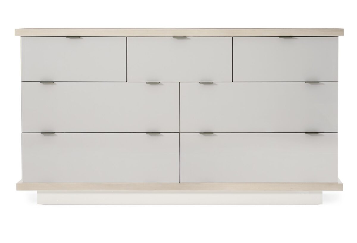 Expressions Dresser by Caracole — a 66″‑wide contemporary dresser with seven back‑painted glass drawer fronts in delicate gray, set within an ash‑taupe hardwood case, featuring notched-tab pulls, soft‑close undermount guides, a low plinth base, and USB ports integrated on both sides.
