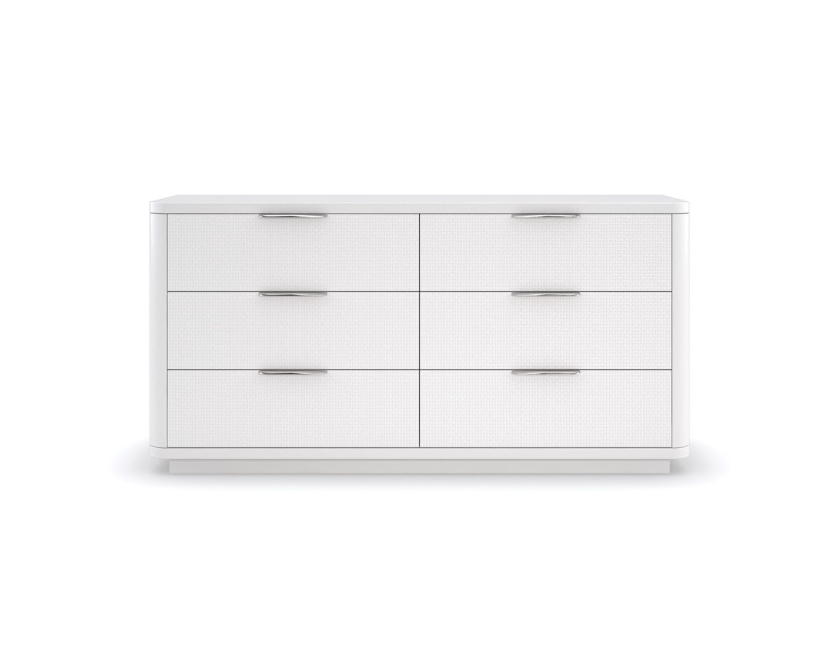 Loving Touch Dresser by Caracole — a 64″‑wide six‑drawer dresser in Cloud White finish, with gently rounded edges, carved drawer fronts featuring a woven mini‑tile motif, clean finger‑cup pulls, and undermount soft‑close guides.