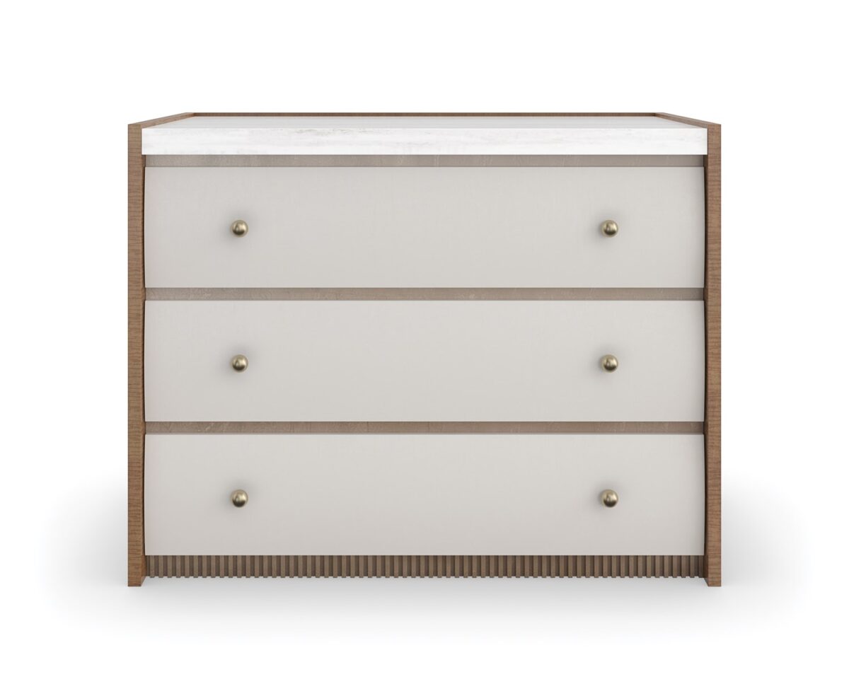 Caracole Avignon Nightstand — a 34″‑wide three‑drawer nightstand with tactile Rockport Burnished Adobe drawer fronts, topped with a striated white Guangxi/onyx stone surface, flanked by Toasted Sycamore end panels, adorned with antique‑bronze‑leaf dentil molding at the base, and brushed‑gold ball knobs on soft‑close undermount guides.