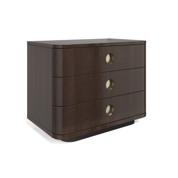 Bachelor Large Nightstand by Caracole — a 32″‑wide masculine nightstand in high‑gloss Otter‑finish Tupelo veneer, featuring three soft‑close drawers with rounded fronts and Champagne‑gold recessed porthole pulls, set on a Dark‑Chocolate plinth base with deep‑finished interiors.