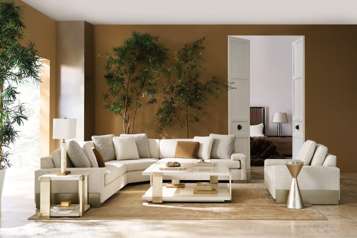 Caracole I'm Shelf-ish LAF Sofa featuring a neutral linen-like fabric with a modern herringbone pattern, wide shelf-arm design, concealed pop-up charging station, and Smoked Sable-finished Fumed Gum wood base.