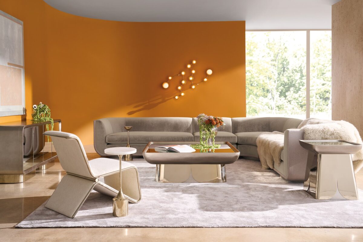 Clipper armless chair from Caracole, showcasing its distinctive curved back and upholstered in two-tone fabric.