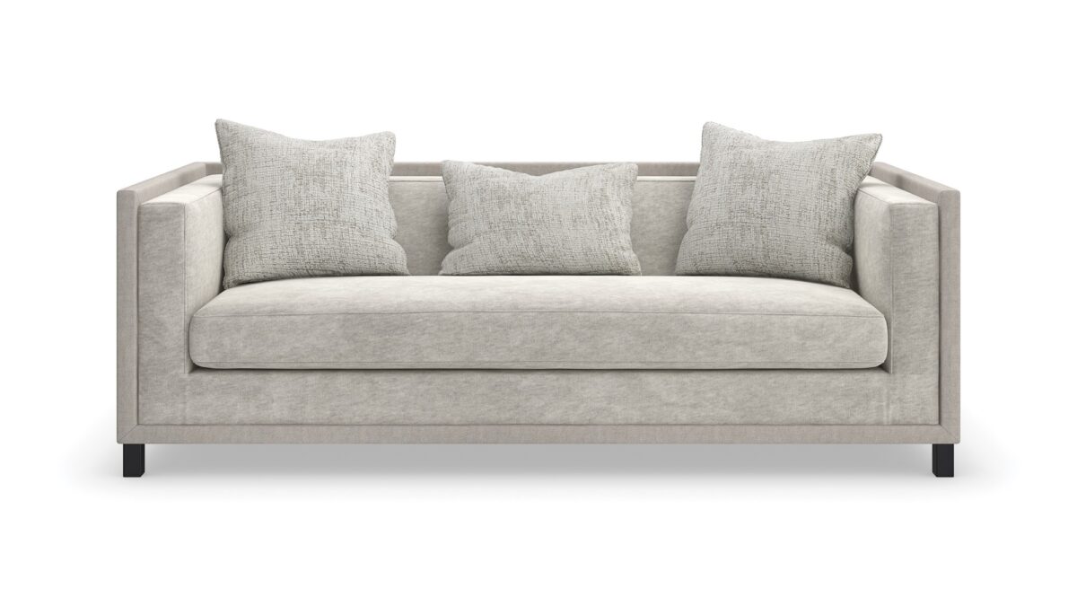 "Classic and refined Tuxedo Sofa by Caracole, featuring a sleek, structured design with plush cushions for a sophisticated and comfortable addition to any living room."