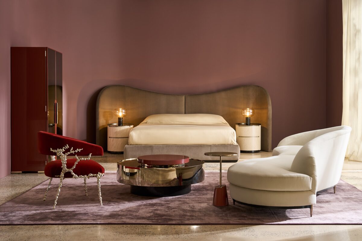 Caracole Clio King Bed featuring an undulating headboard fully upholstered in ultra-soft Dark Taupe angora-like velvet, with sideboards and footboard in matching fabric, and a Dark Chocolate wood base.