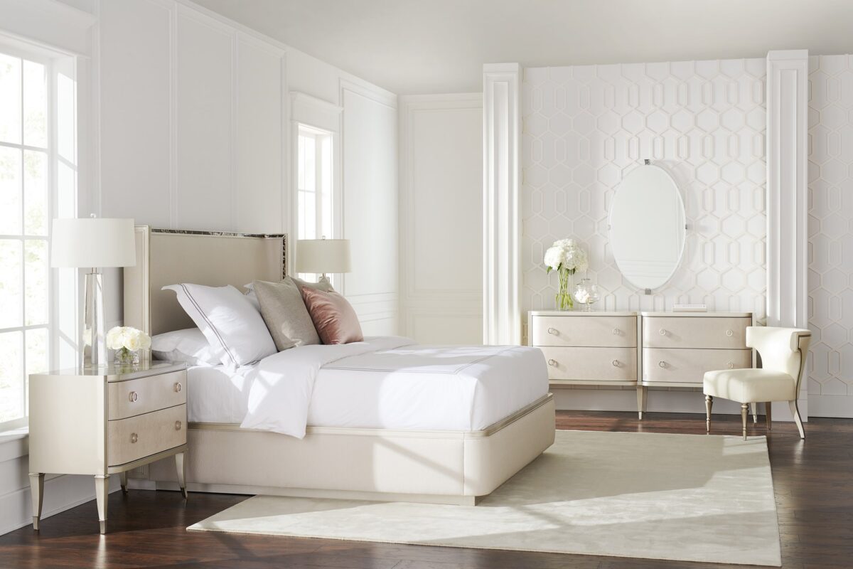 Caracole Dream Big California King Bed featuring a gently curving headboard with acrylic tortoise shell-inspired inlay, upholstered footboard and side rails in performance fabric, and a contemporary plinth base in Soft Silver Paint.