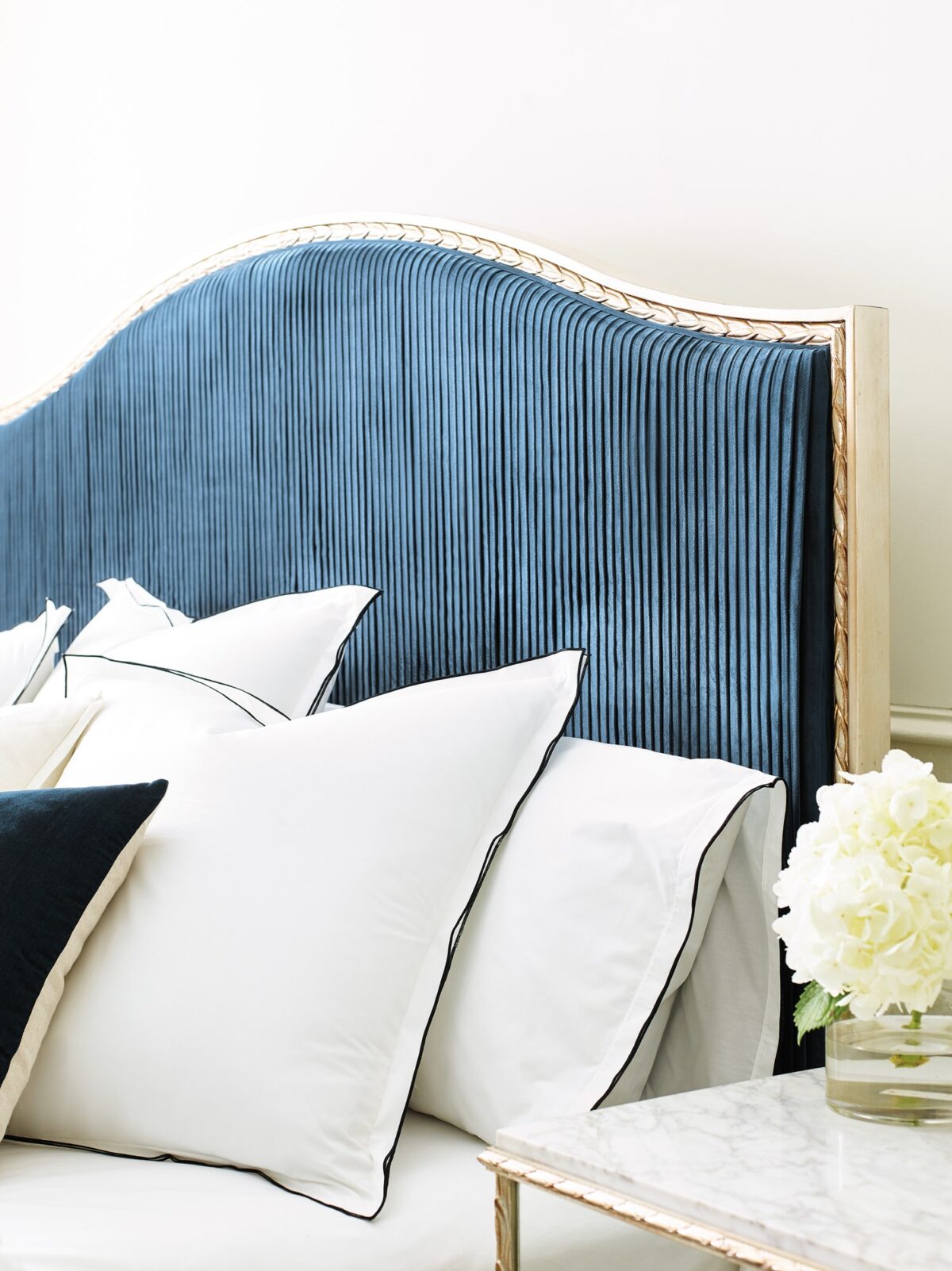 Caracole Fontainebleau Platform King Bed featuring a fully upholstered frame with exposed wood trim finished in Oracle Silver Leaf, complemented by an adjustable height bedding support.