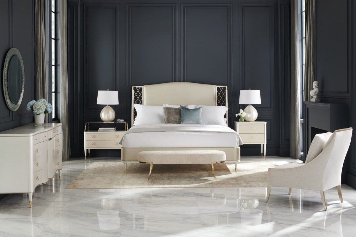 Glamorous king bed with a tall, deeply tufted headboard and mirrored or metallic accents, STAR OF THE NIGHT-King by Caracole.
