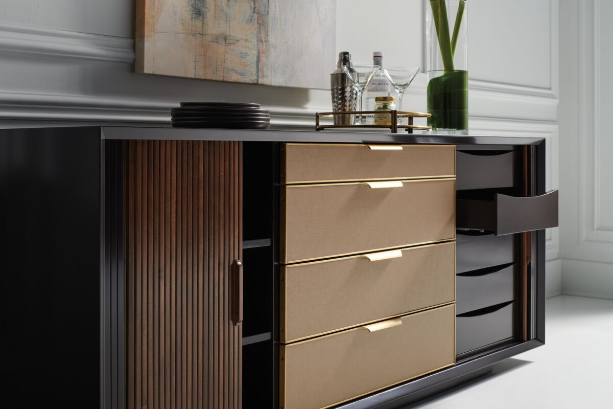 Contemporary ALL WRAPPED UP chest by Caracole, showcasing its clean lines and a subtle metallic trim or base that complements its wrapped exterior.