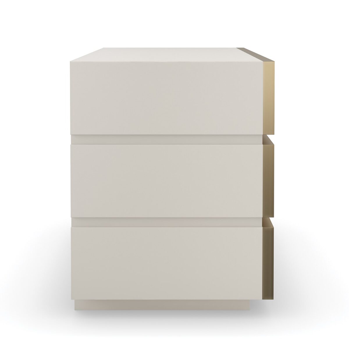 Bedrock Nightstand by Caracole — a 34″‑wide three‑drawer nightstand with polished gray sandstone fronts featuring subtle champagne‑gold trim and ring pulls, set in a creamy Almond Milk wood frame with a matching plinth base and soft‑close undermount drawer guides.