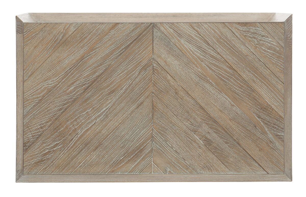 Caracole CROSSED PURPOSES table, featuring a dynamic metal base with crisscrossing or overlapping forms, creating a visually engaging structure.