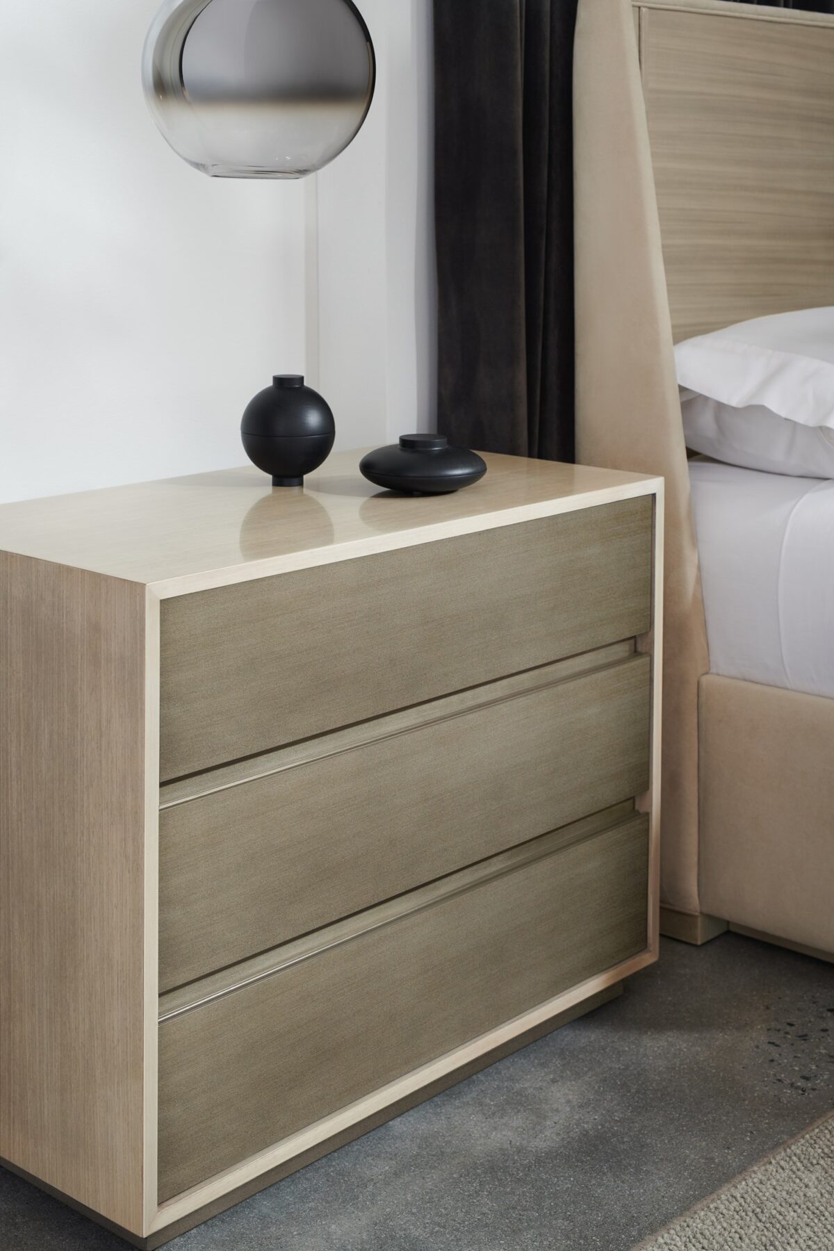 Contemporary large nightstand with a sleek two-tone finish and ample storage, FROM VITA DUO Large Nightstand by Caracole.