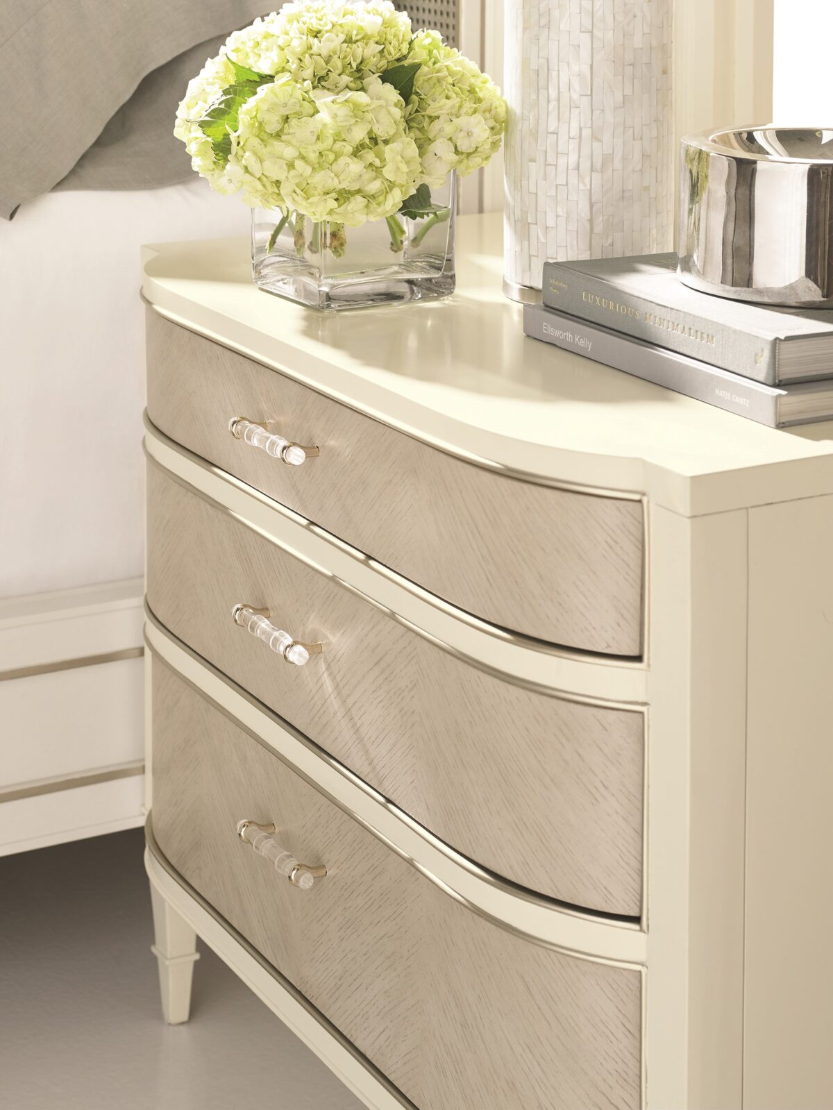 Modern chest of drawers with a unique wrapped exterior and contrasting metallic accents, DOUBLE WRAP by Caracole.