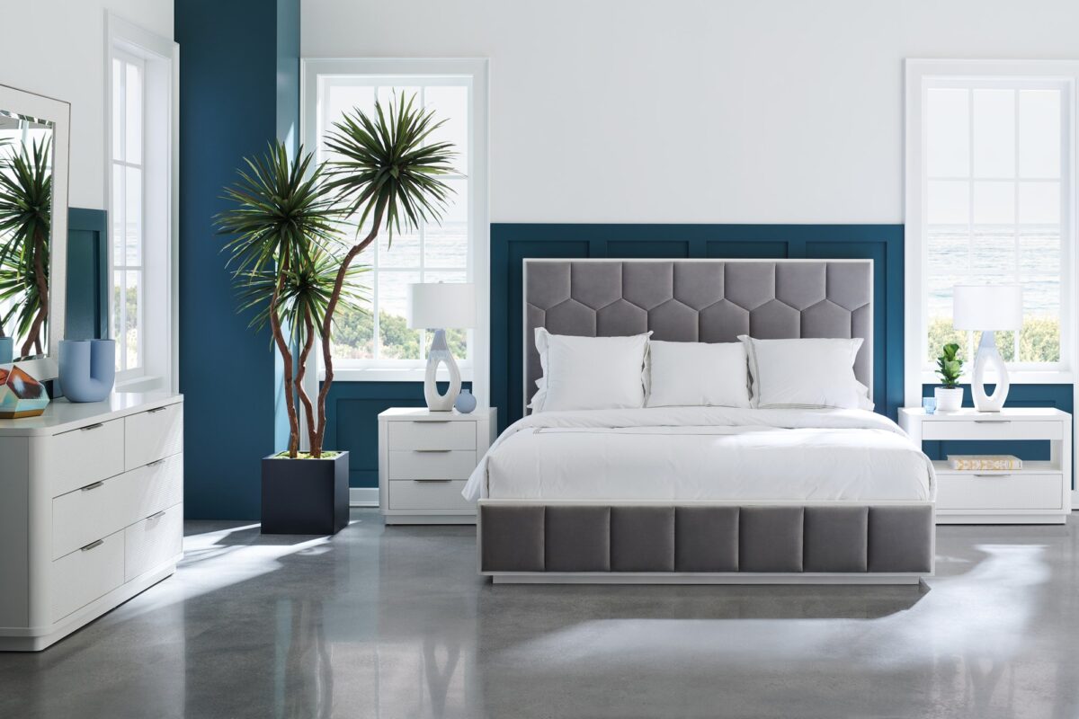 In Touch by Caracole" refers to a bedside table/nightstand. It's characterized by rounded edges, a clean-lined "Cloud White" finish, carved drawer fronts with a "woven mini-tile motif," finger-cup pulls in Satin Nickel, two drawers, and open center storage with a built-in light, a USB port, and wire management holes.