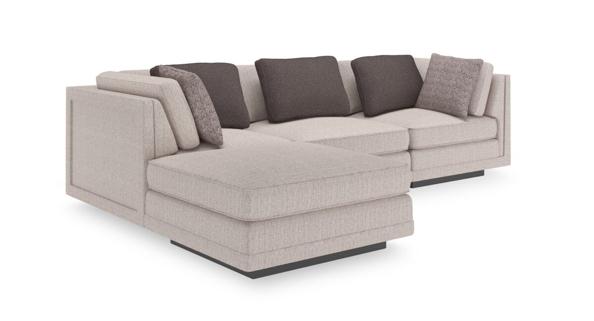 Caracole Fusion Armless Chair with neutral oatmeal tweed upholstery, a deep gunmetal grey accent pillow, and a recessed wood plinth base in Simply Black.
