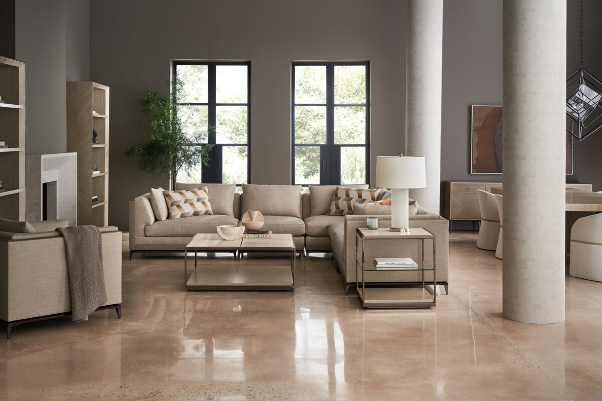 Caracole Archipelago RAF Loveseat featuring neutral twill upholstery with faux leather accents, exposed Bourbon Glaze wood base, Deep Bronze
