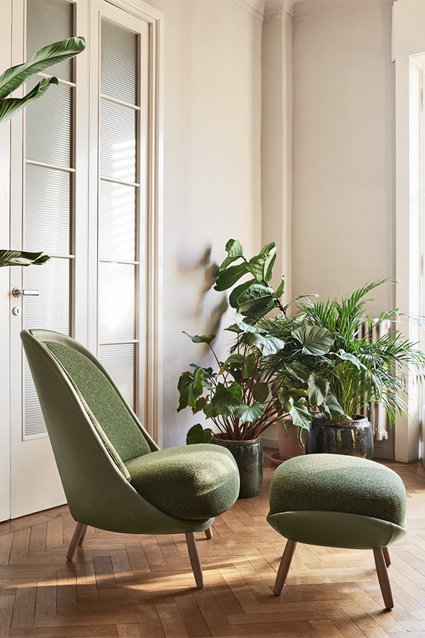 “Contemporary lounge chair – Calatea by Pianca featuring artistic form and luxurious upholstery”