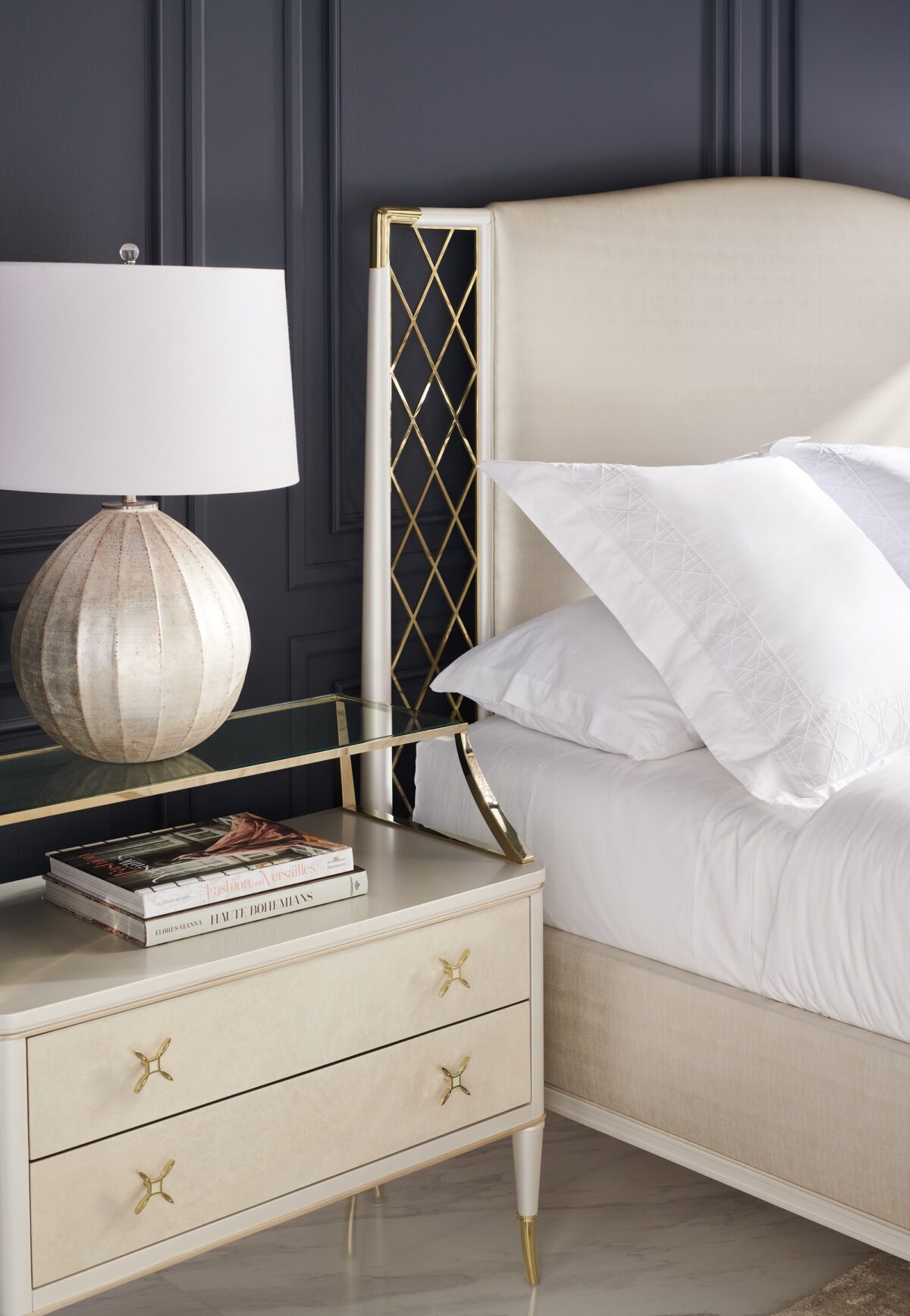 Glamorous king bed with a tall, deeply tufted headboard and mirrored or metallic accents, STAR OF THE NIGHT-King by Caracole.