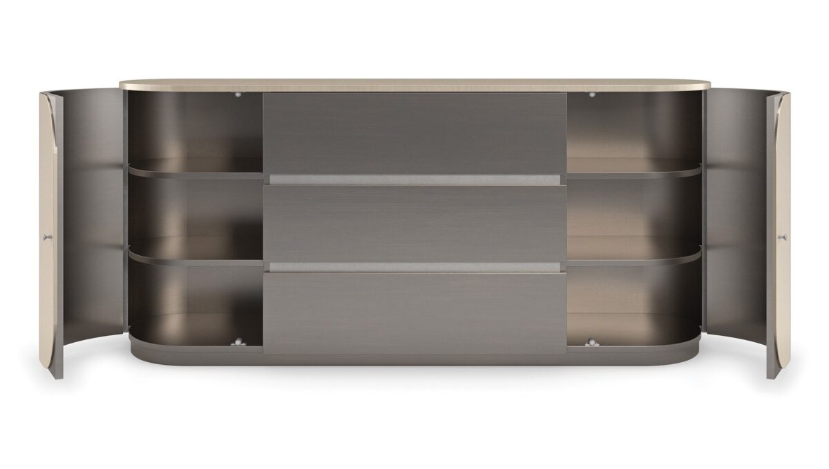 Vita Duo Dresser by Caracole—a sleek oval dresser with dual-tone Smoked Stainless Steel finish, featuring two curved doors with subtle wood grain and three central drawers for a modern minimalist aesthetic.