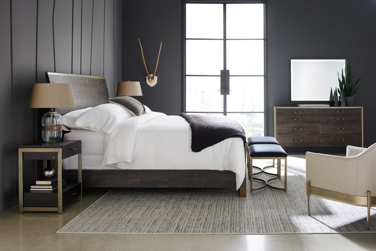 ReMix Double Dresser by Caracole — a 66″‑wide double dresser with eight soft‑close drawers; case and interior in black‑stained ash, drawer fronts in cerused oak, accented with a slim bronze‑gold metal frame and matching bronze‑painted trim, including a top‑left drawer with removable dividers.