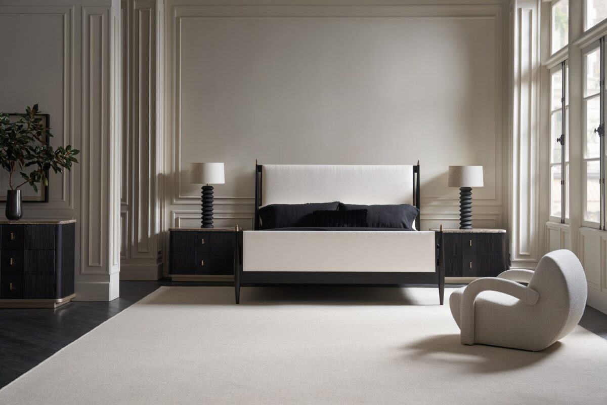 Rhythm Dresser by Caracole — a 69½″ wide six-drawer dresser featuring tactile reeded drawer fronts in Sun Drenched Oak finish, topped with creamy Travertine stone and set on a low neutral‑metal plinth, with rounded corners, bronze bar pulls, and soft‑close undermount guides.