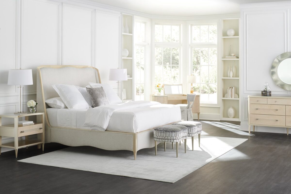 Clearly Open Nightstand by Caracole — a 24″‑wide modern nightstand featuring a frosted glass top with a crescent-shaped curve, supported by a Champagne Pearl–finished base. It includes a single soft-close drawer with a Natural Glow wood front, open storage above and below, and a clear acrylic pull rod capped in Satin Nickel.