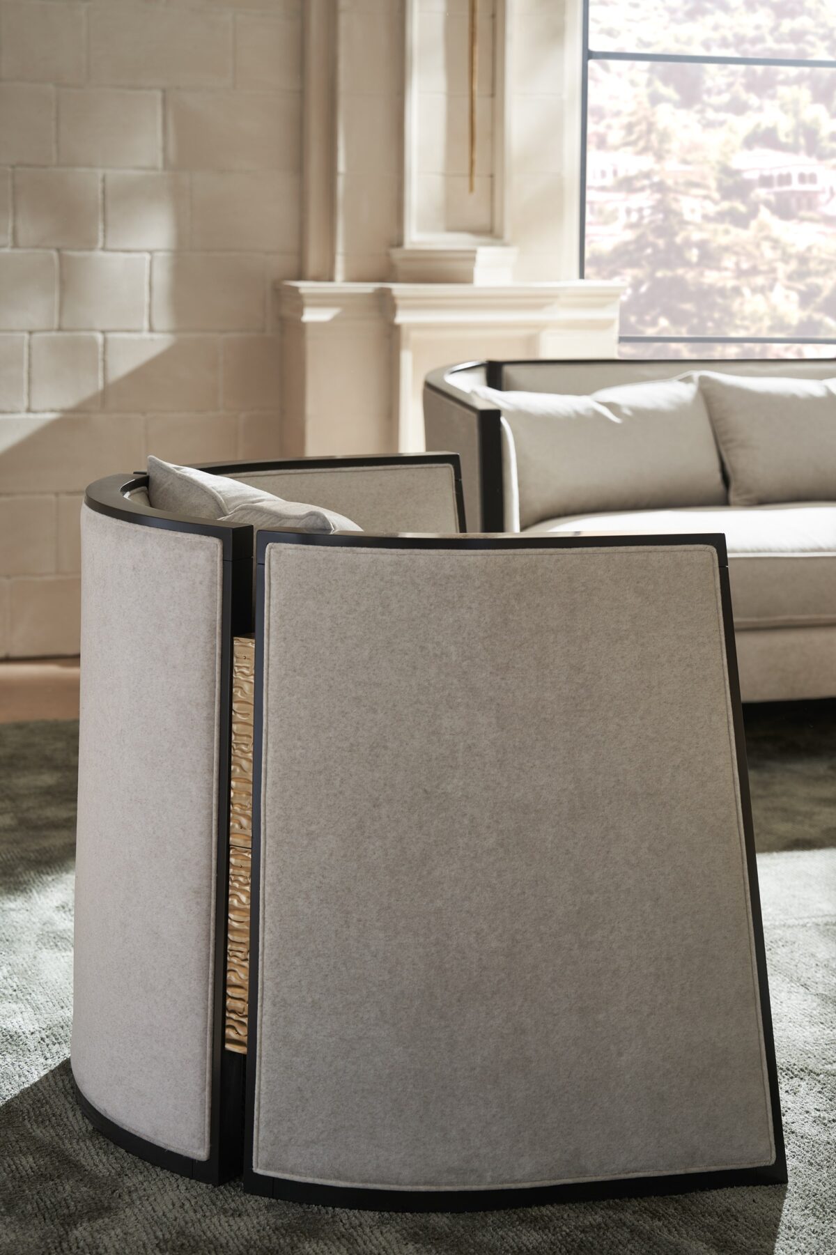 "Chic and contemporary Cut Away Sofa by Caracole, offering a striking design with clean lines and luxurious seating for a modern living space."