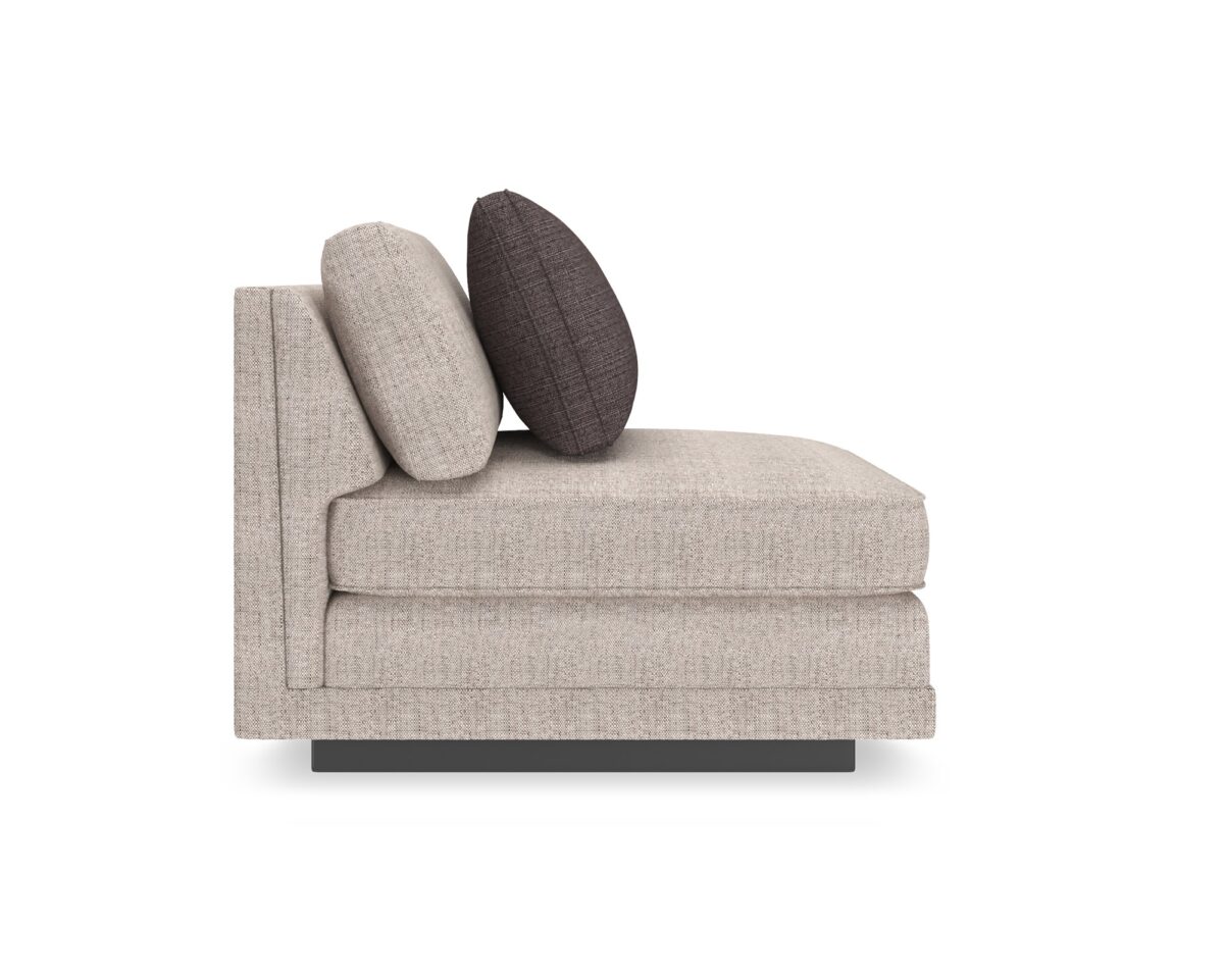Caracole Fusion Armless Chair with neutral oatmeal tweed upholstery, a deep gunmetal grey accent pillow, and a recessed wood plinth base in Simply Black.