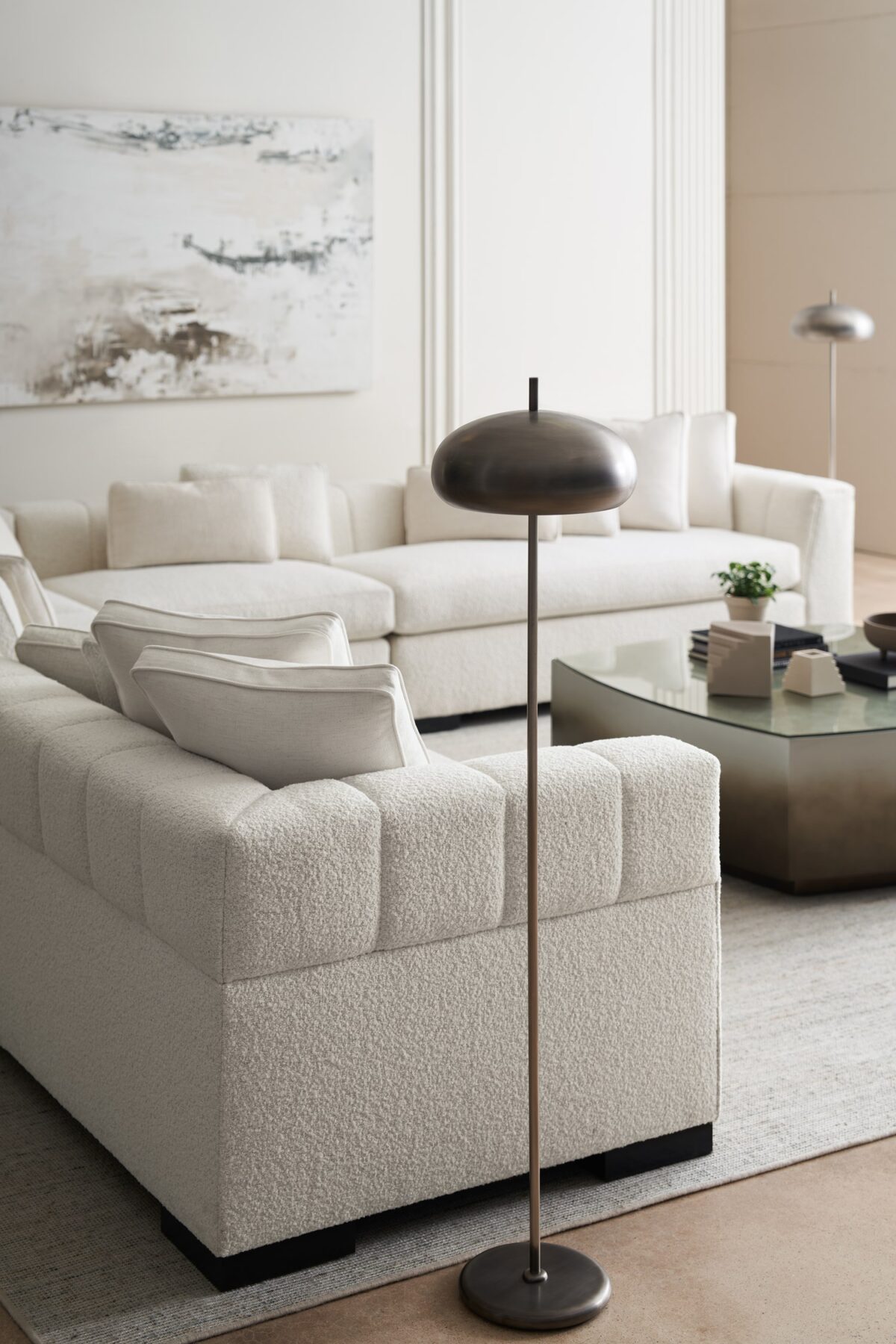 Caracole Edge Corner with loose seat cushions, tight back, and Satin Ebony wood feet, offering a sleek, contemporary design.