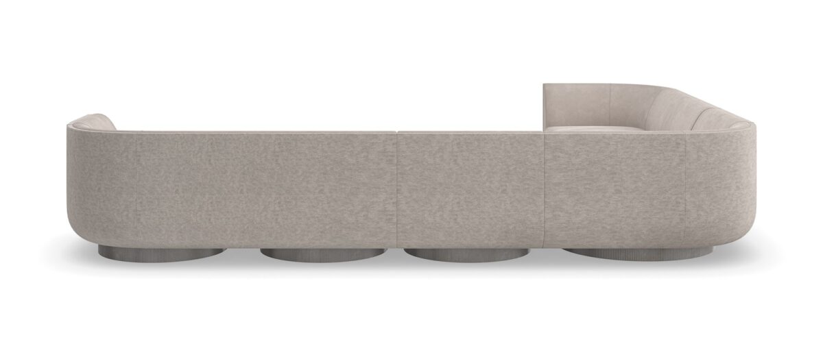 Clipper armless chair from Caracole, showcasing its distinctive curved back and upholstered in two-tone fabric.