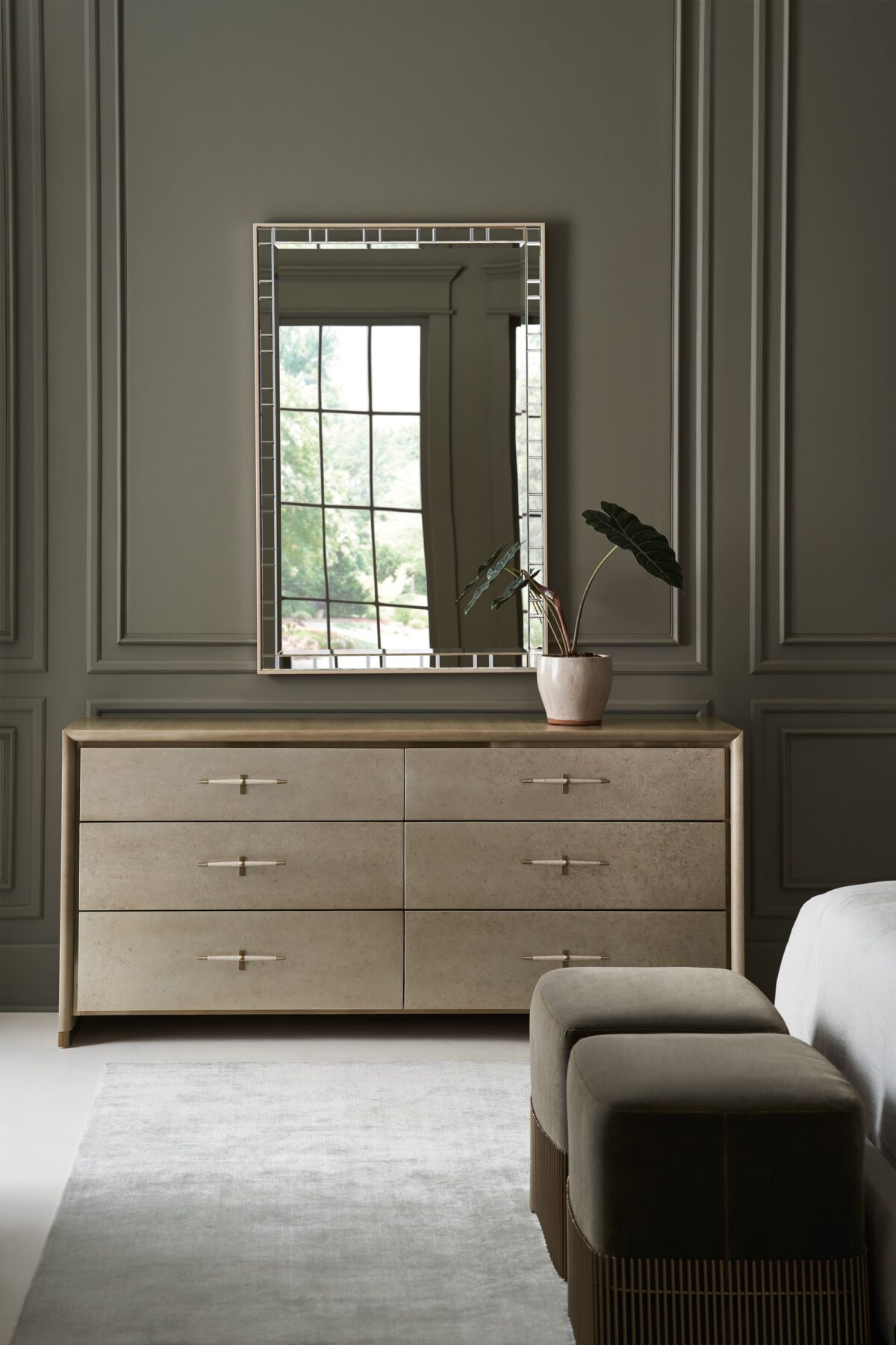 Hang Up Dresser by Caracole — a 70‑inch wide classic dresser with six drawers featuring metallic leaf-finish fronts that shimmer like frosted glass, set in a Dry Martini-finished hardwood frame with recessed metal trim, tapered faux‑leather-wrapped pulls in brushed gold and nickel, soft‑close drawers, and linen-painted interior with top drawer dividers and a removable jewelry tray.