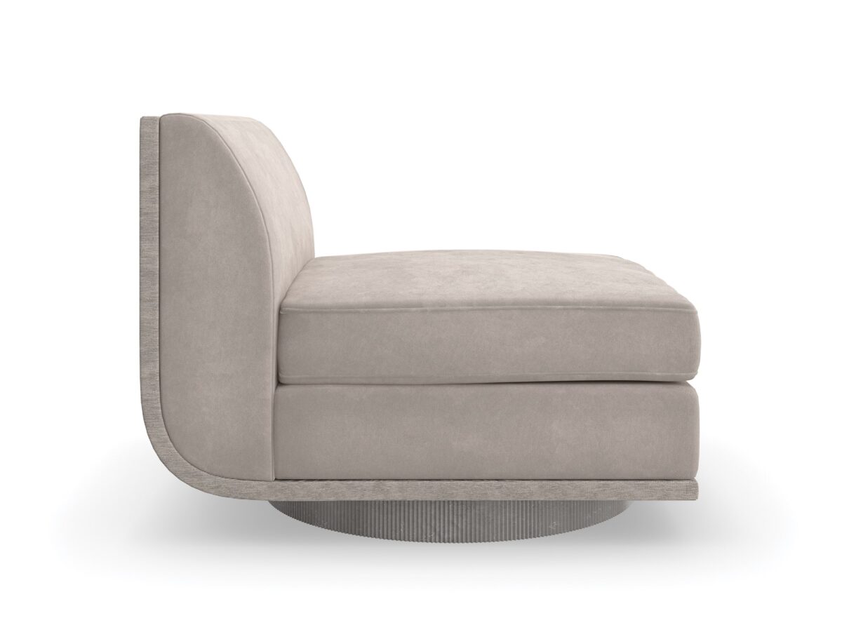 Clipper armless chair from Caracole, showcasing its distinctive curved back and upholstered in two-tone fabric.