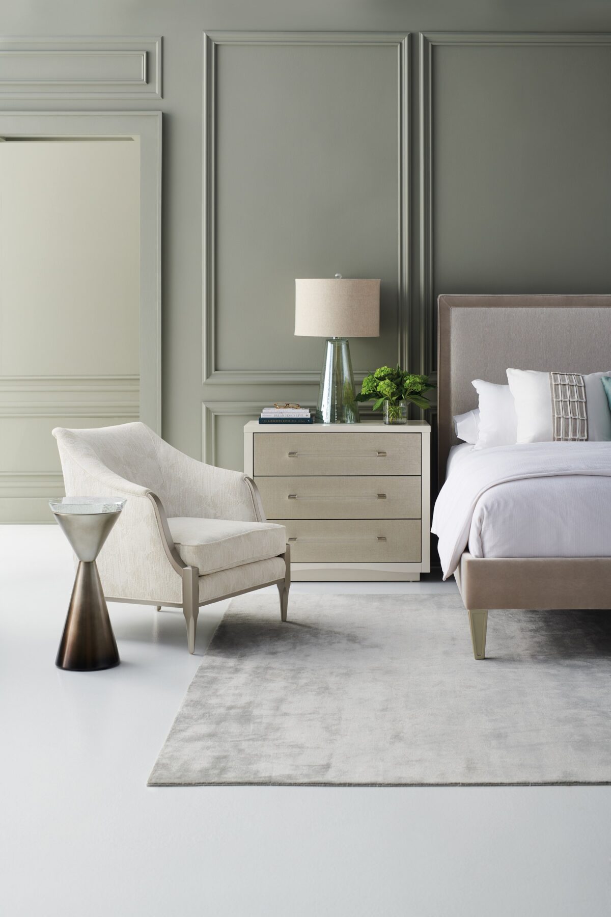 A Clear Touch chest by Caracole — a 38″‑wide three‑drawer chest in Pearly White textured finish, with sun‑kissed silver raffia-wrapped drawer fronts, clear acrylic rod pulls capped in satin nickel, undermount soft‑close guides, and painted pearly-white drawer interiors.