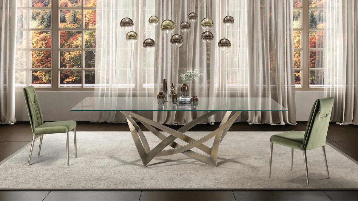 Infinito 72 by Reflex showcased in Royal Oak Michigan showroom, modern Italian luxury dining table with sculptural forged iron base and glass top.