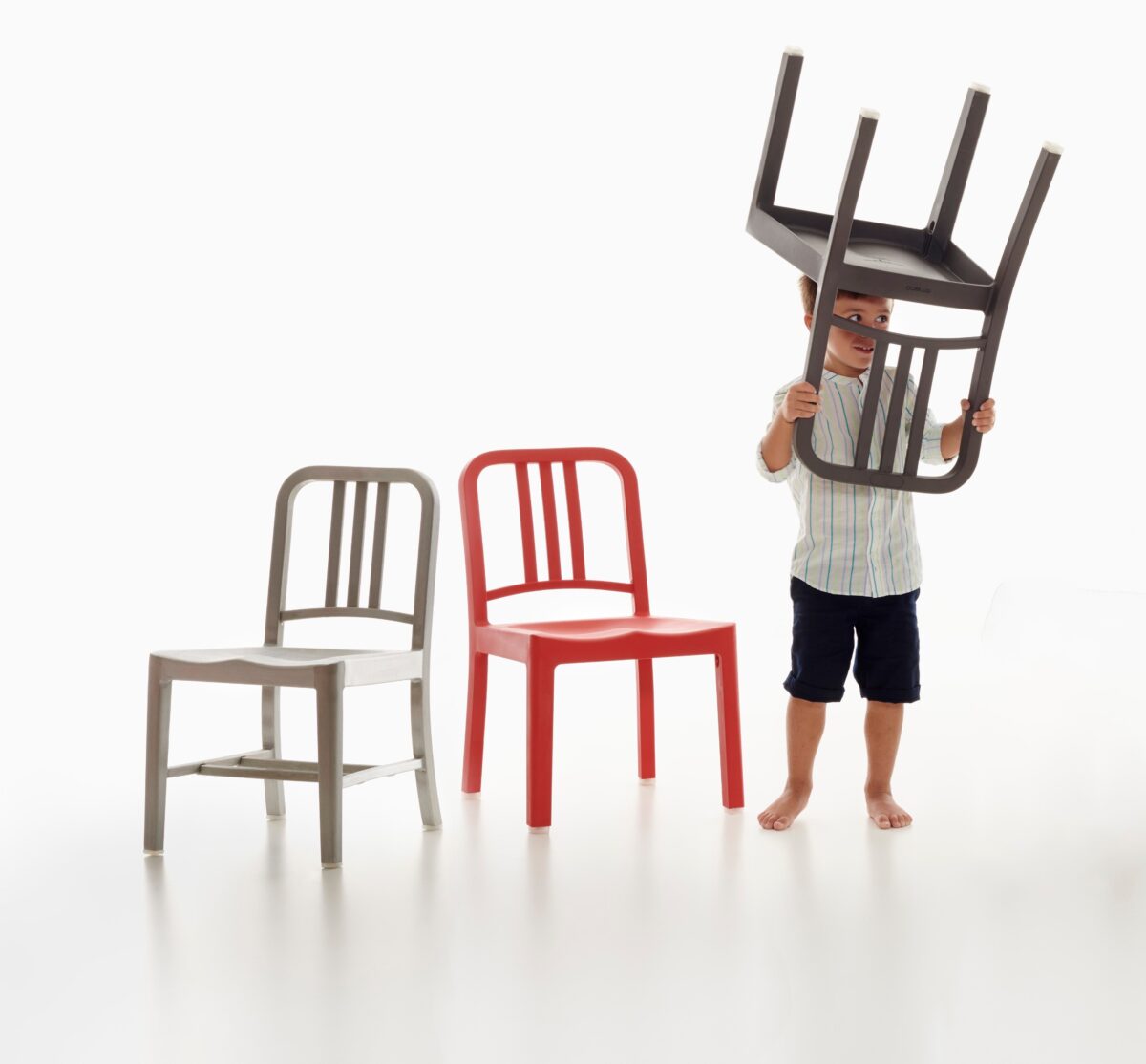 “Lightweight and durable 1006 Navy Mini Chair by Emeco, ideal for small spaces.”