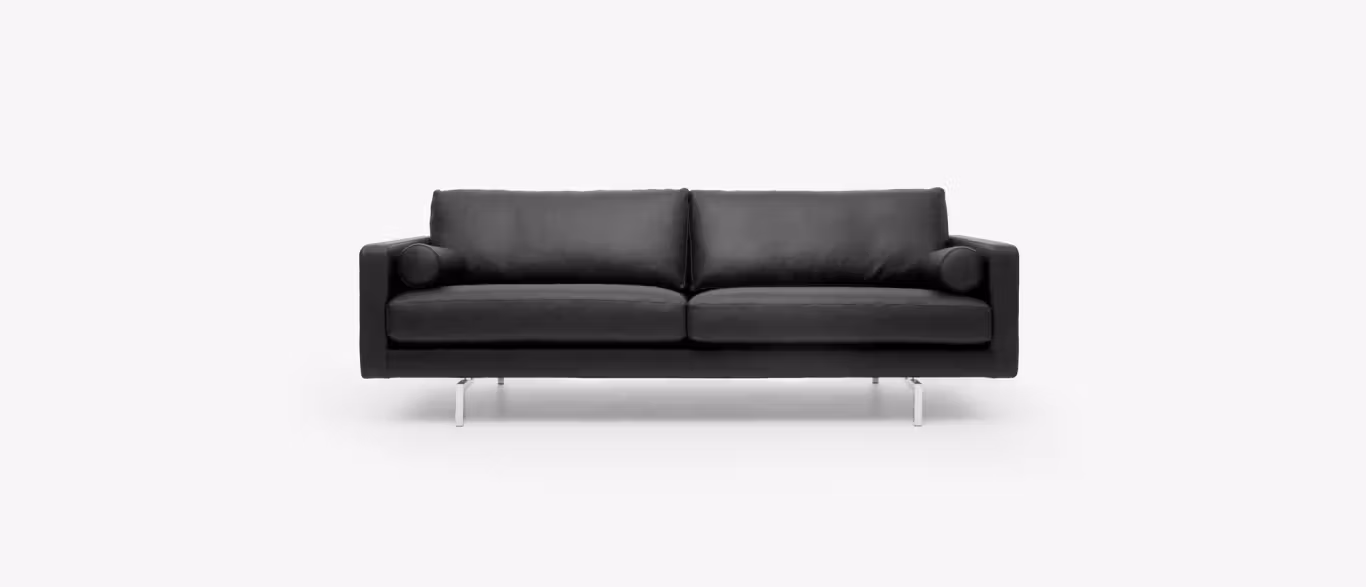 Lite by Bensen lounge chair in soft gray fabric with slim black metal legs in a modern living room