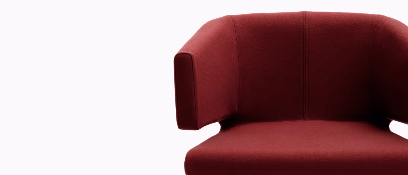 Lotus by Bensen lounge chair in soft beige fabric with rounded, petal-like backrest and slim metal legs in a modern living room