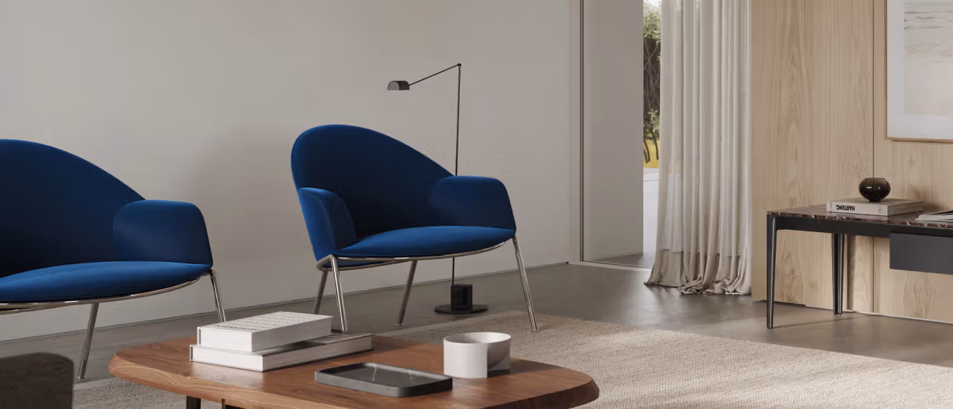 Circa Lounge with Armrests by Bensen in soft beige fabric featuring a curved backrest and padded armrests on slim metal legs