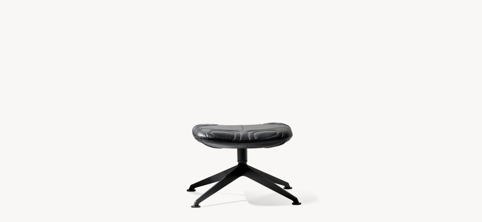 “Longwave armchair by Moroso – modern Italian designer chair with smooth flowing curves and plush upholstery”
