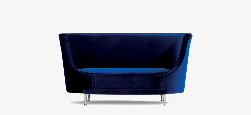 Side view of the Backside sofa by Moroso, showcasing its sharp-edged silhouette and plush seating.