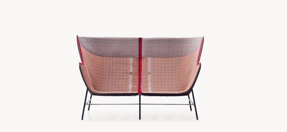 Moroso Paper Planes sofa in grid-patterned textile, blending precise geometry with minimalist elegance.