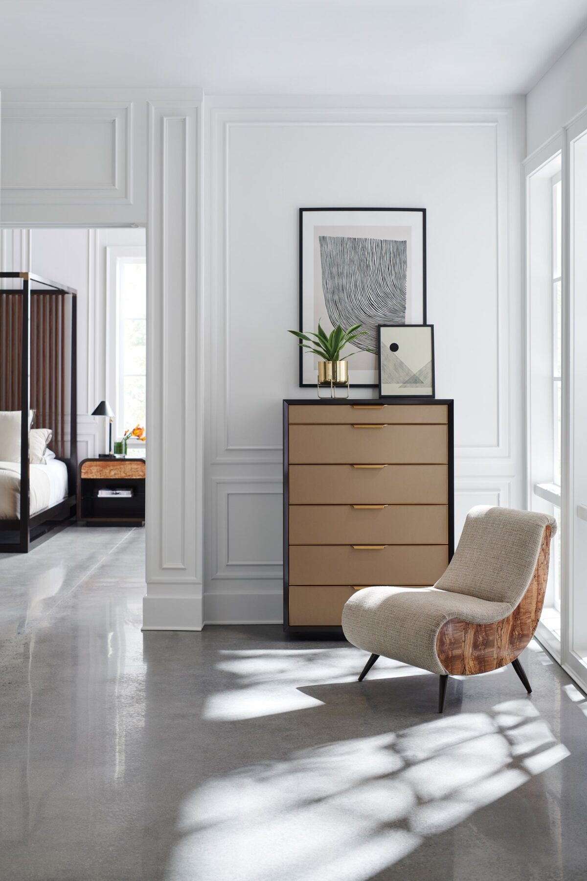 Caracole WRAP IT UP table, featuring a distinctive metal base that playfully encircles and frames the tabletop, creating an artistic design.