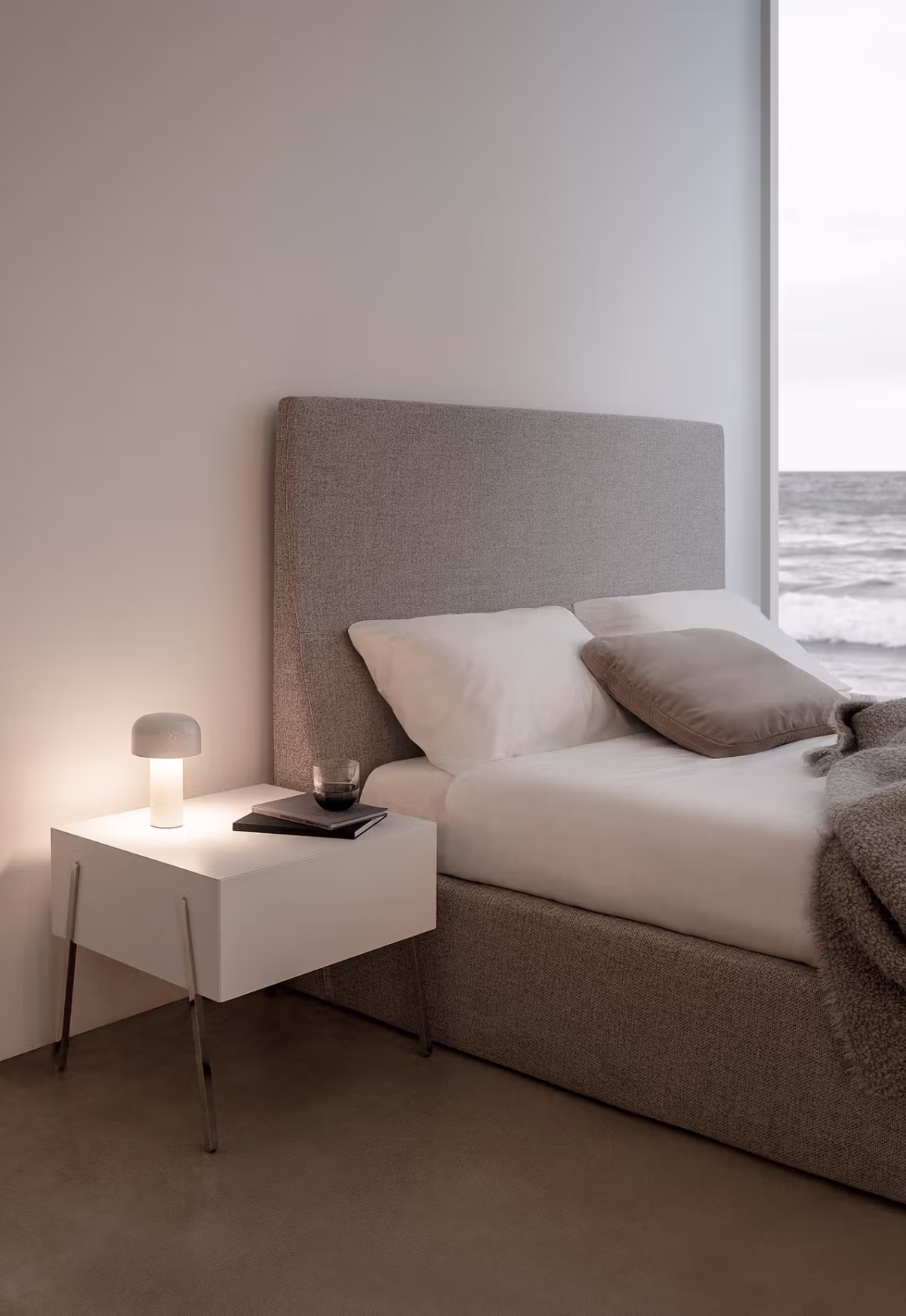 Spacious open-plan interior featuring Everest by Bensen in soft beige with a minimalist coffee table and rug
