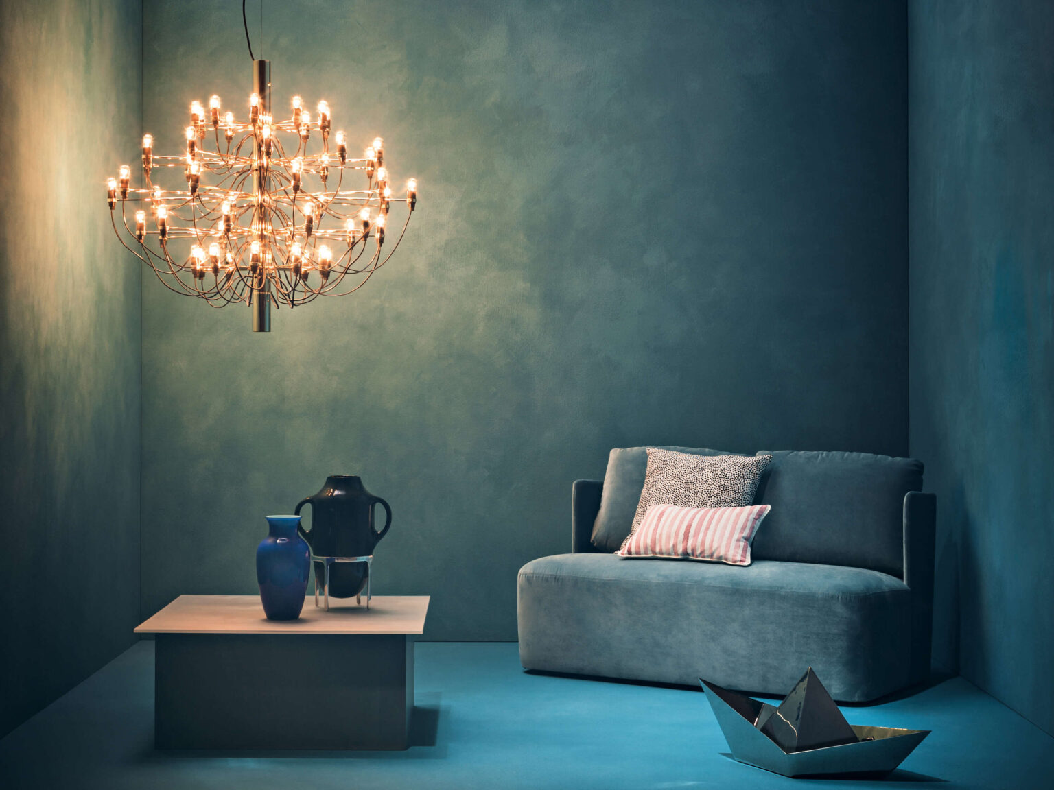 Side angle of the 2097/50 pendant showing its tiered brass arms and transparent LED bulbs in a crystal-like formation.